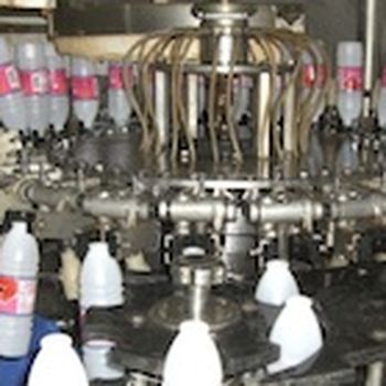 Clean bottles by inverting them and injecting with water