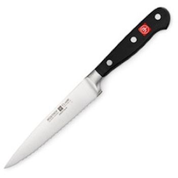 Serrated or scalloped edges on a knife blade